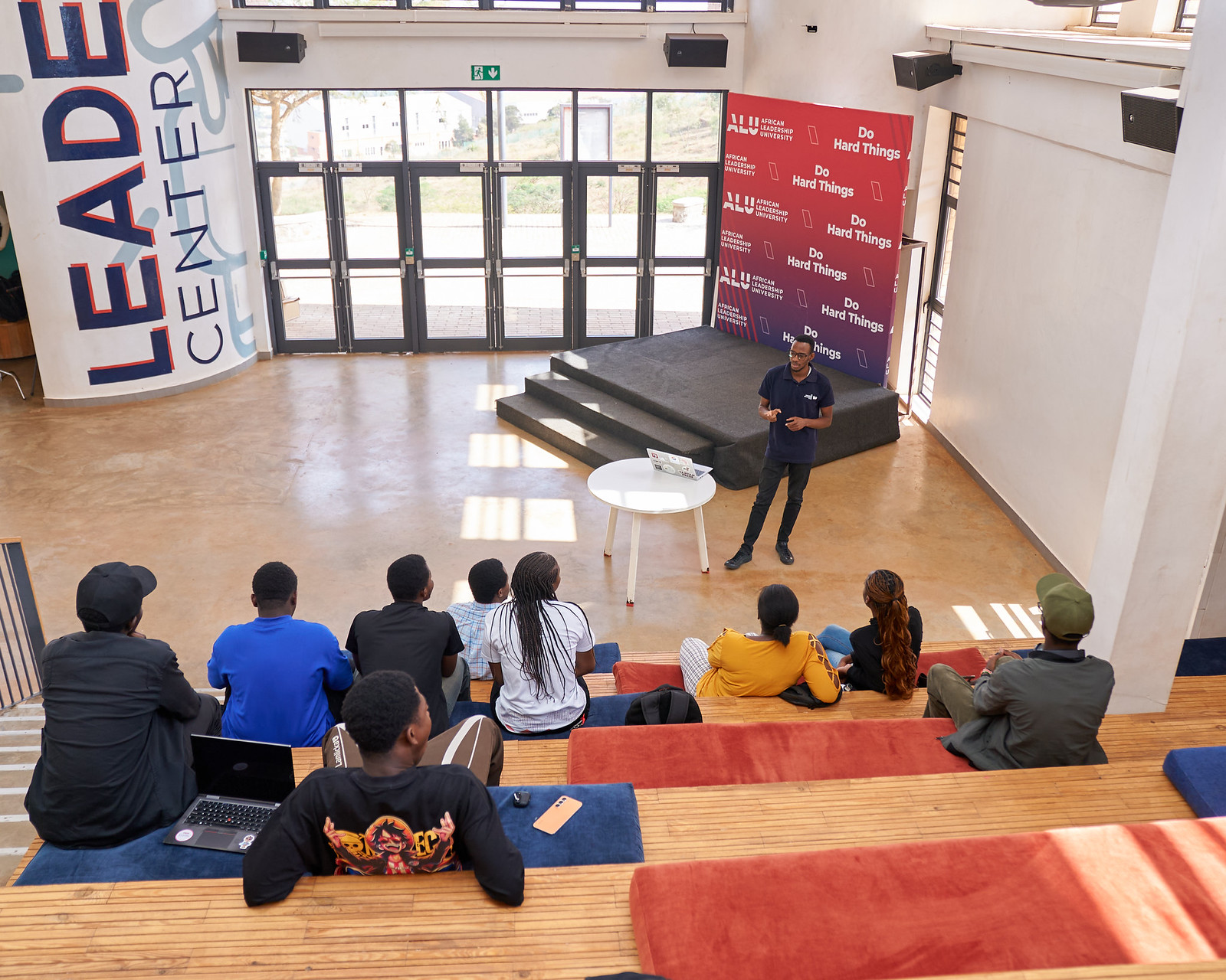A speaker sharing ideas with students at ALU